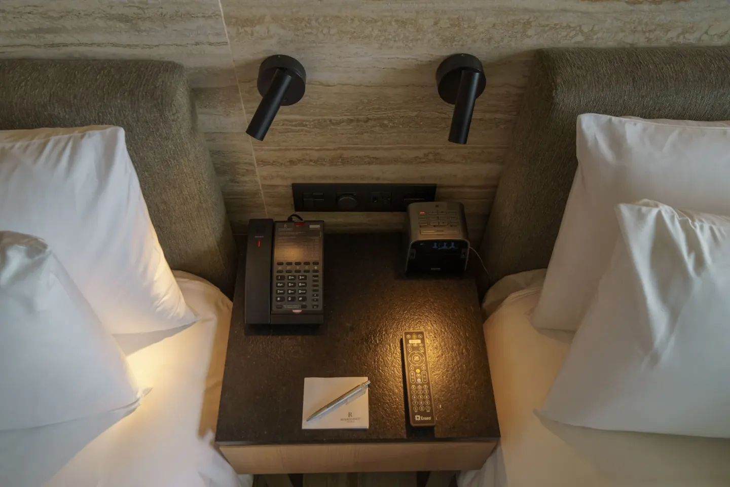 Bedside table between two beds in a Deluxe Balcony room at Renaissance Cancun Resort & Marina.