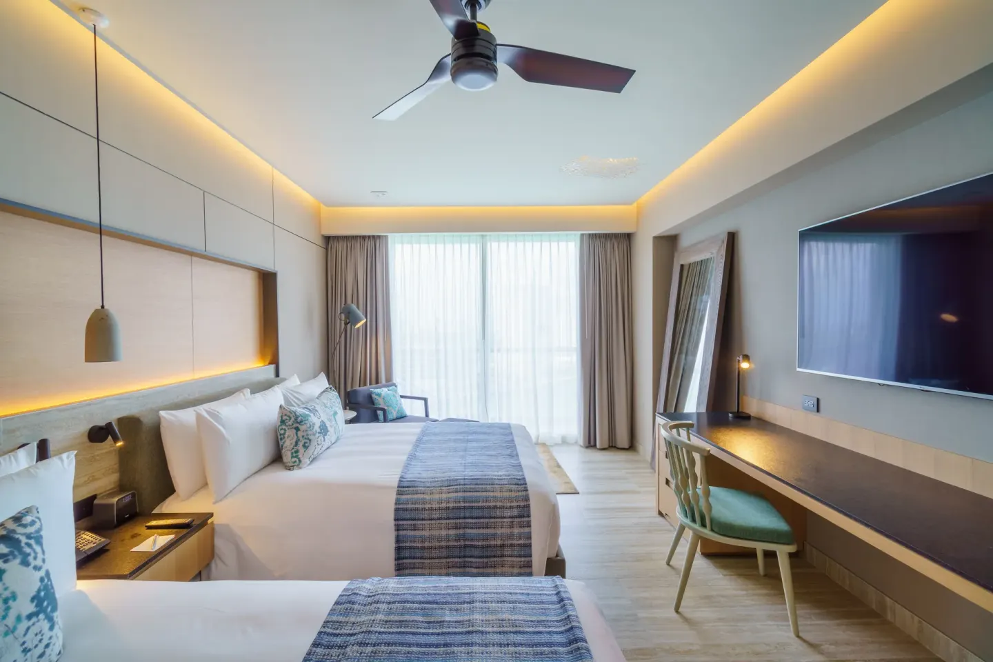 Deluxe Balcony guest room with two beds at Renaissance Cancun Resort & Marina.