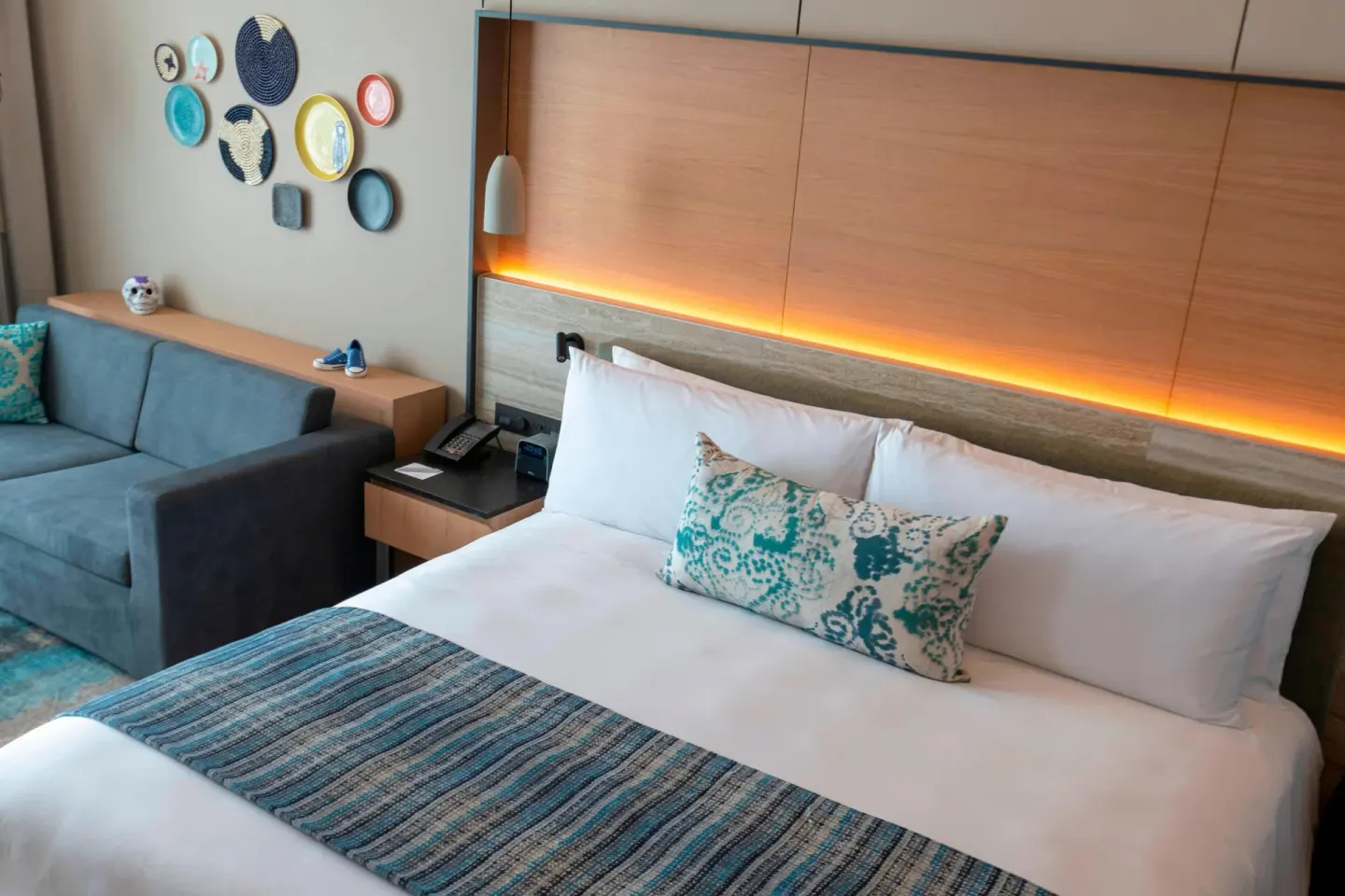King bed and sofa bed corner in a deluxe room at Renaissance Cancun Resort & Marina.