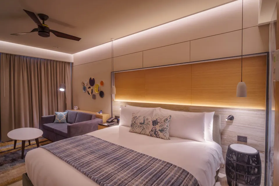 Deluxe room with king bed and sofa bed at Renaissance Cancun Resort & Marina.