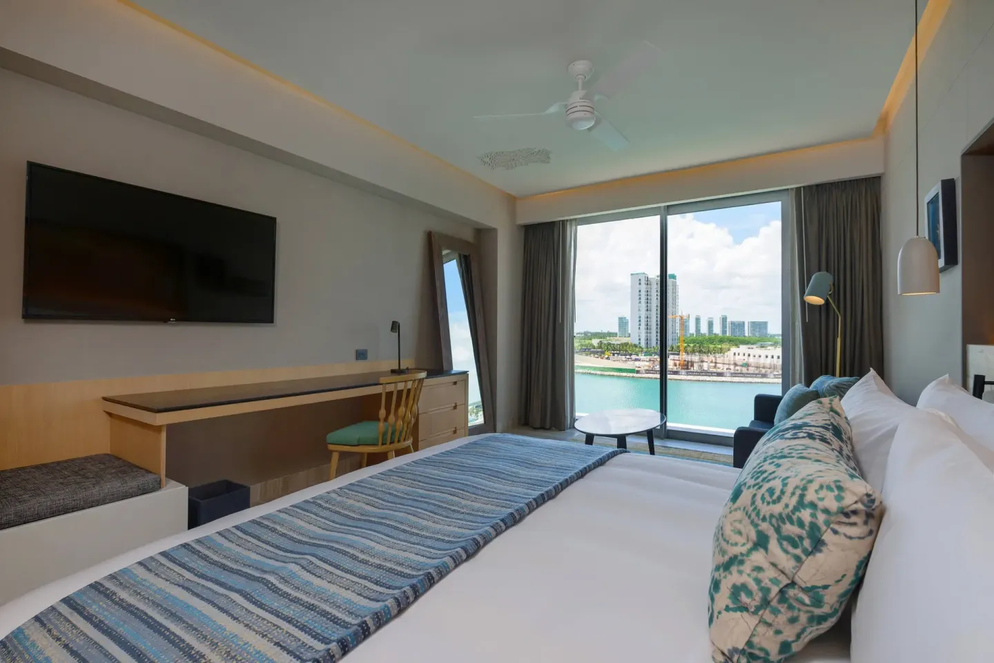 Marina-view king guest room with sofa bed at Renaissance Cancun Resort & Marina.