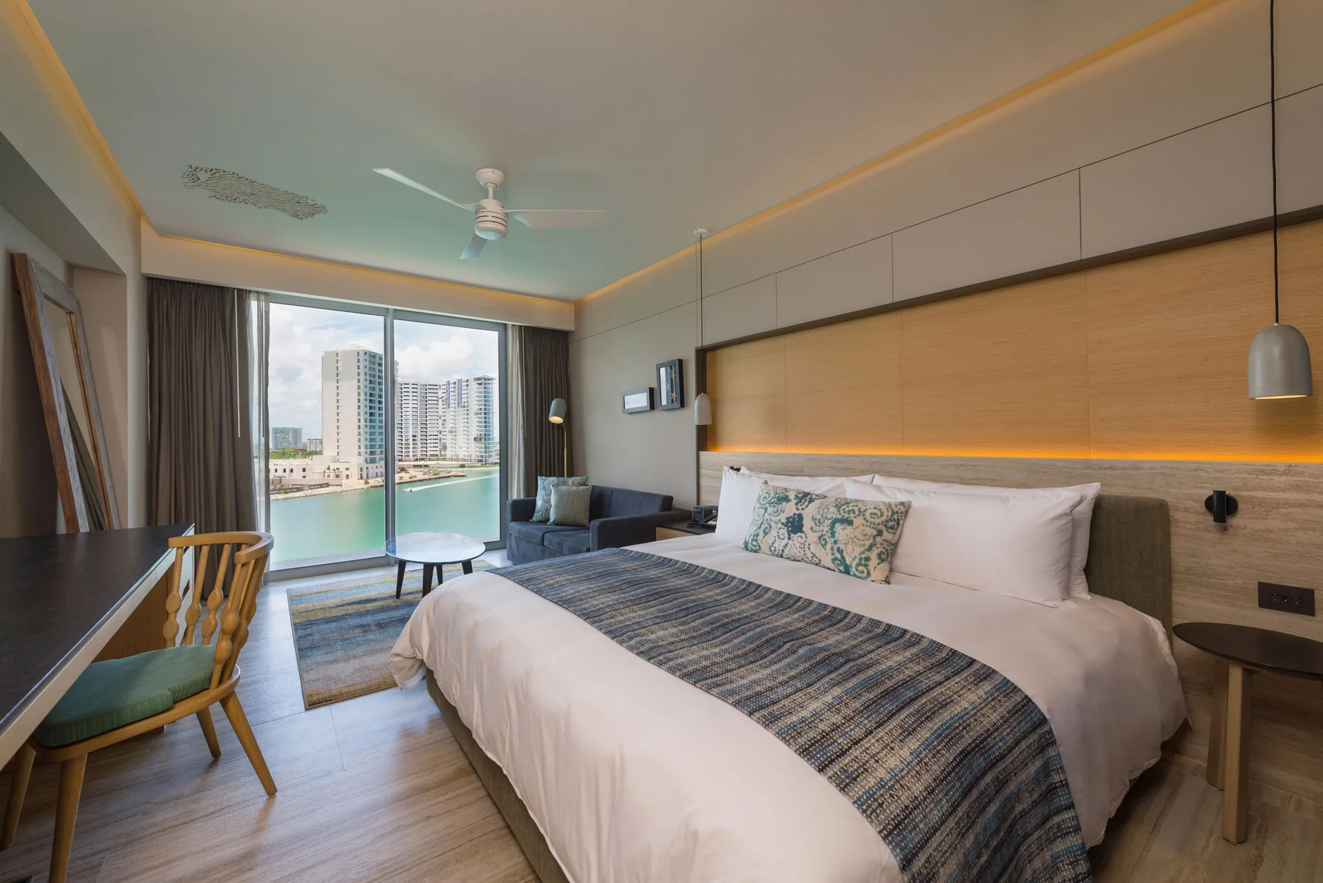 King room with sofa bed and marina view at Renaissance Cancun Resort & Marina.