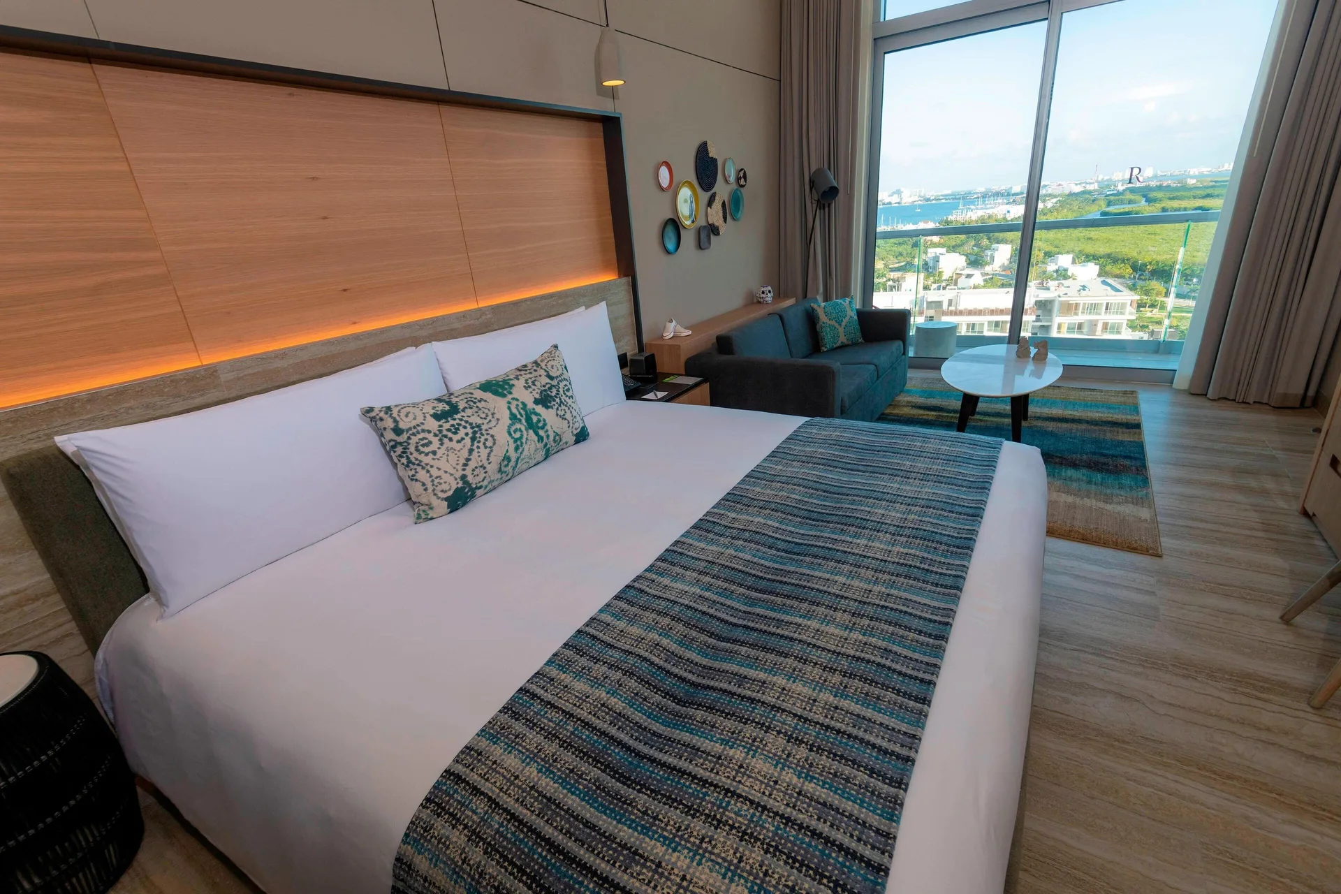 Room with Sofa Bed Ocean View Balcony at Renaissance Cancun featuring king bed, pull-out sofa, and oceanfront balcony views in Cancun's Hotel Zone.