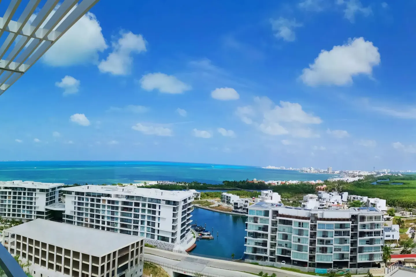 Ocean and marina view from a balcony at Renaissance Cancun Resort & Marina.