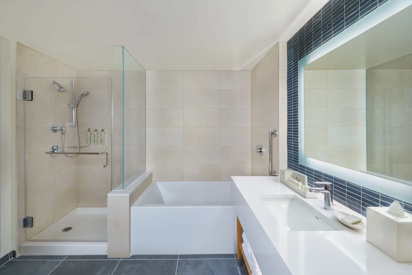 Bathroom with glass shower, soaking tub, and vanity at Renaissance Honolulu Hotel & Spa.