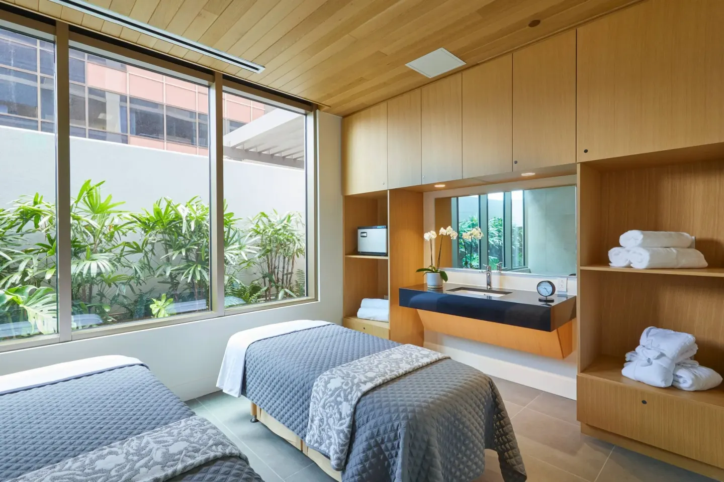 Spa treatment room with two tables at Renaissance Honolulu Hotel & Spa.