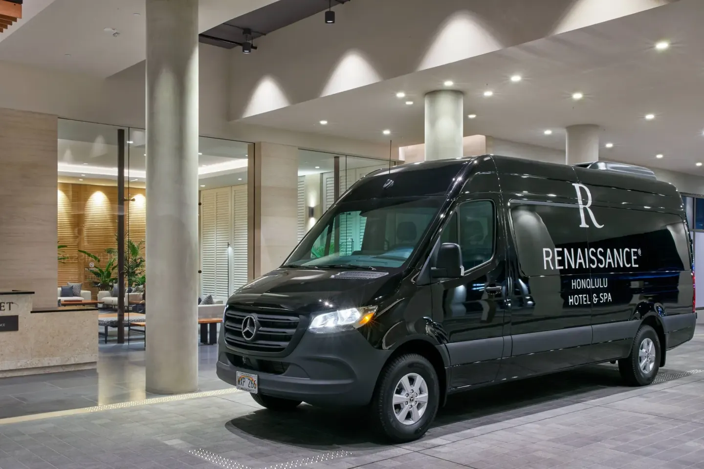 Hotel shuttle van at the entrance of Renaissance Honolulu Hotel & Spa.