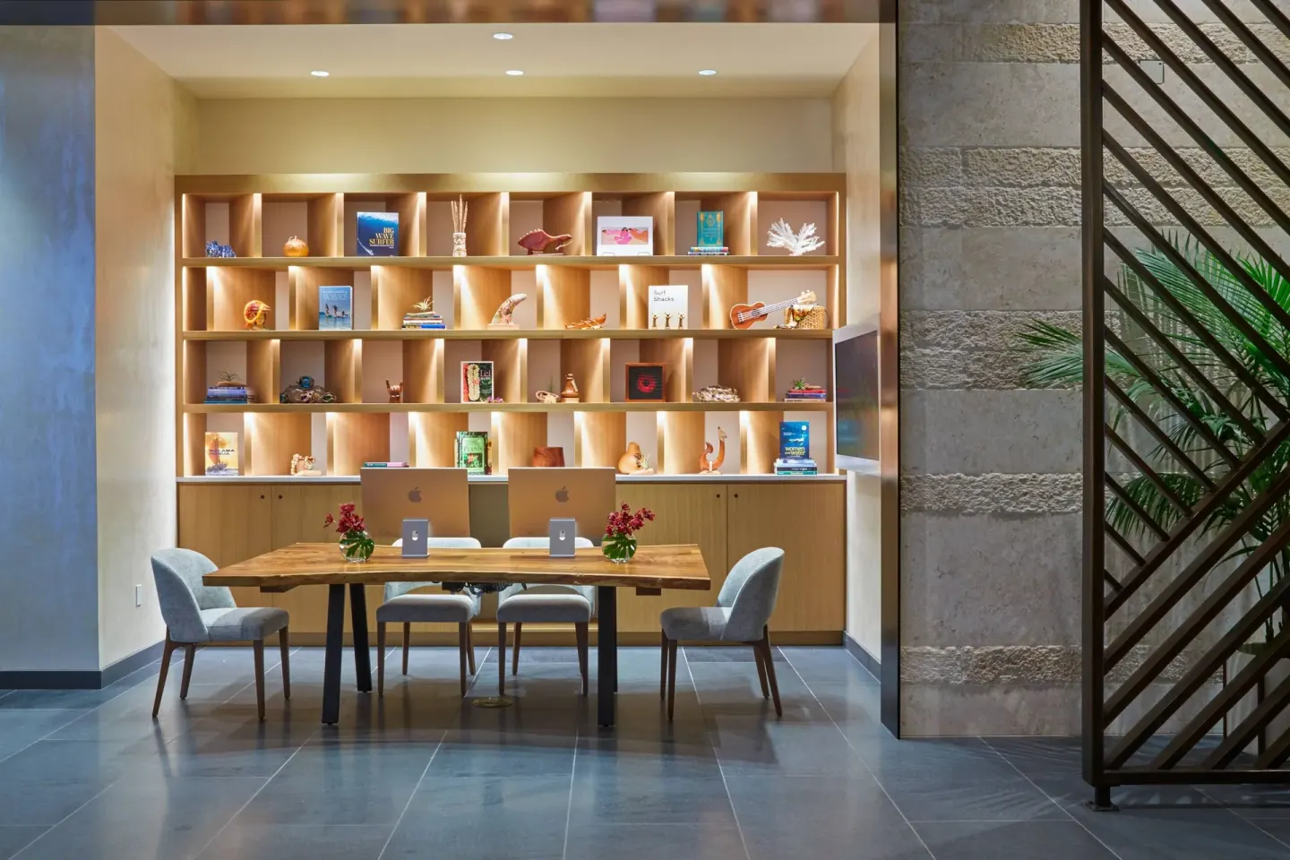 Lobby work table and illuminated display shelves at Renaissance Honolulu Hotel & Spa.