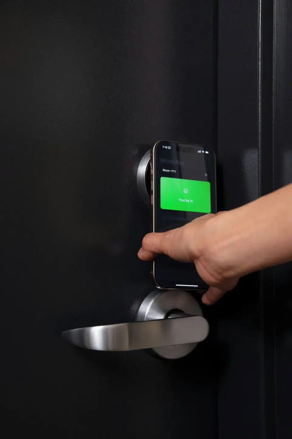 Mobile phone room key unlocking a guest door at Renaissance Honolulu Hotel & Spa.