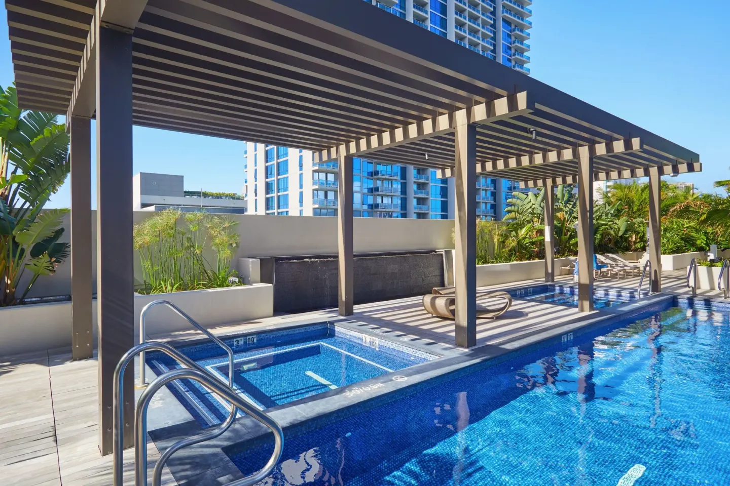 Pool and spa area under a pergola at Renaissance Honolulu Hotel & Spa.