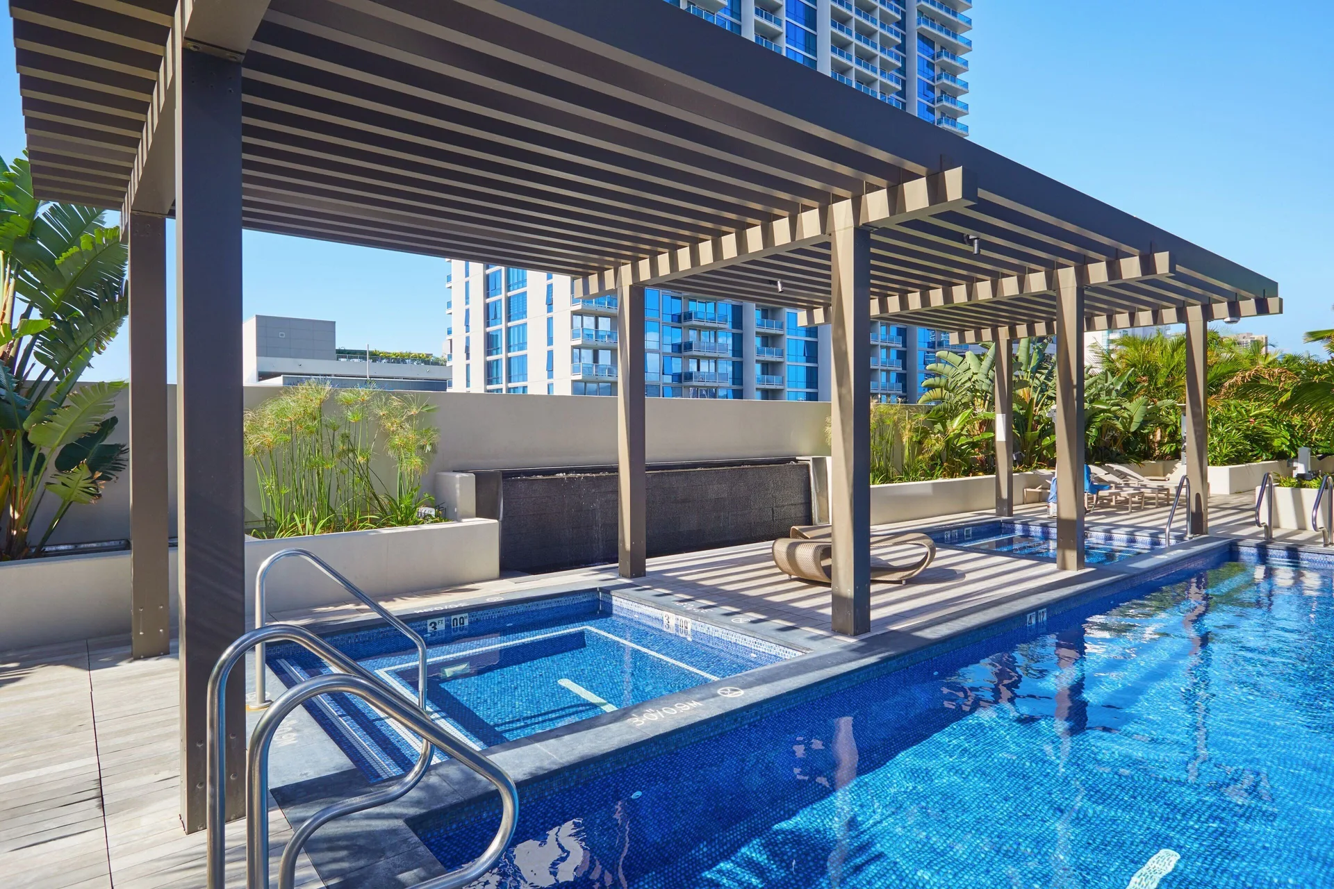 Pool and spa area under a pergola at Renaissance Honolulu Hotel & Spa.