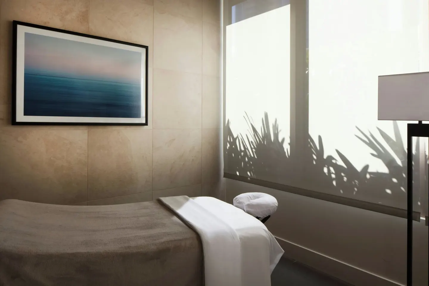 Spa treatment bed and wall art at Renaissance Honolulu Hotel & Spa.