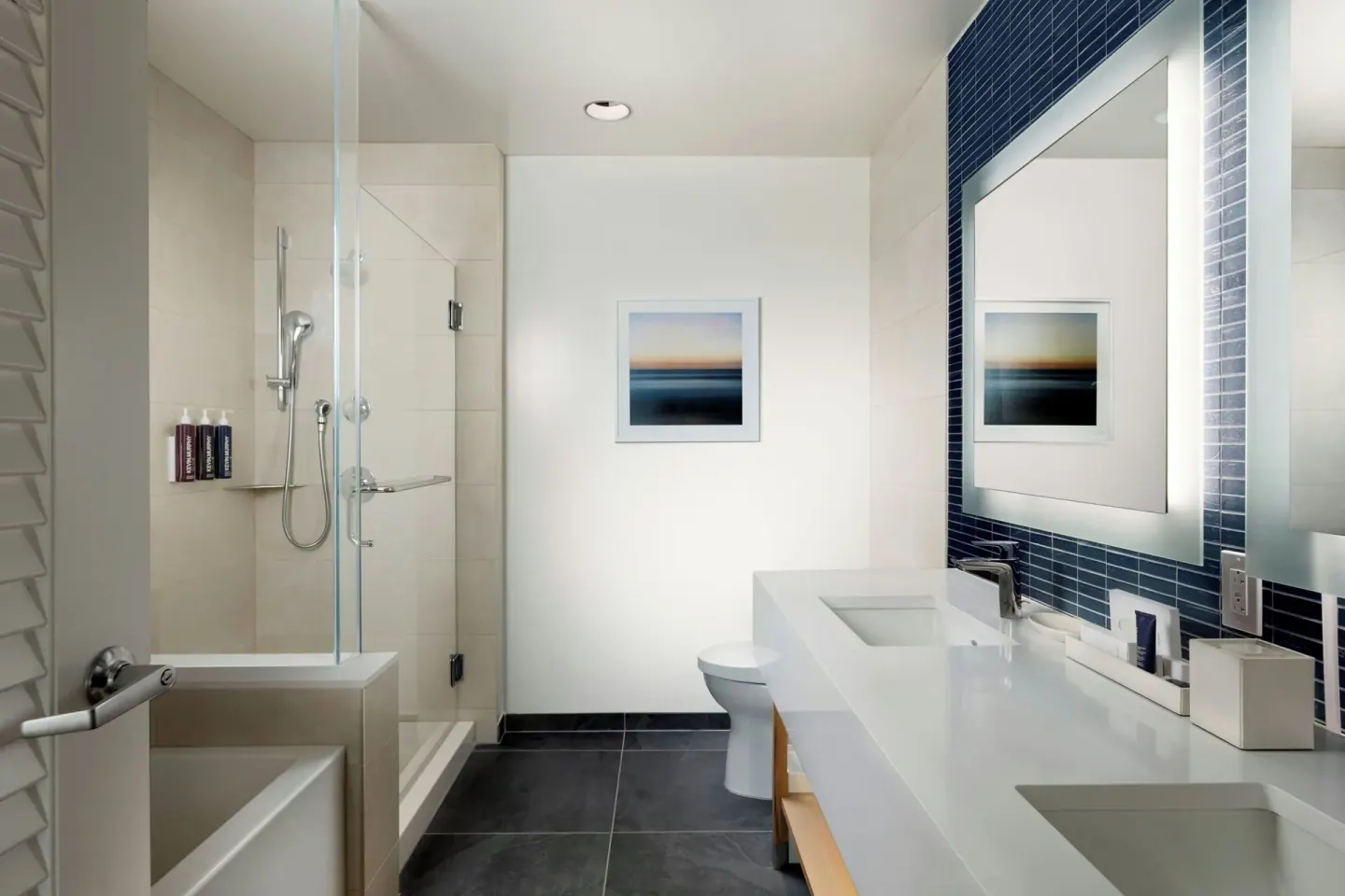 Bathroom with tub and shower in the Alani Penthouse suite at Renaissance Honolulu Hotel & Spa.