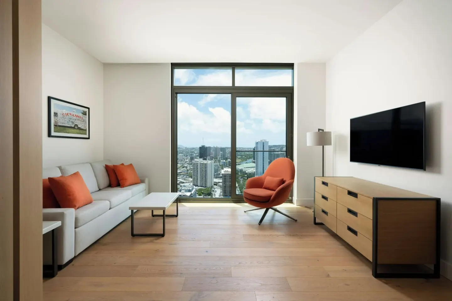 Living room city view in the Alani Penthouse suite at Renaissance Honolulu Hotel & Spa.