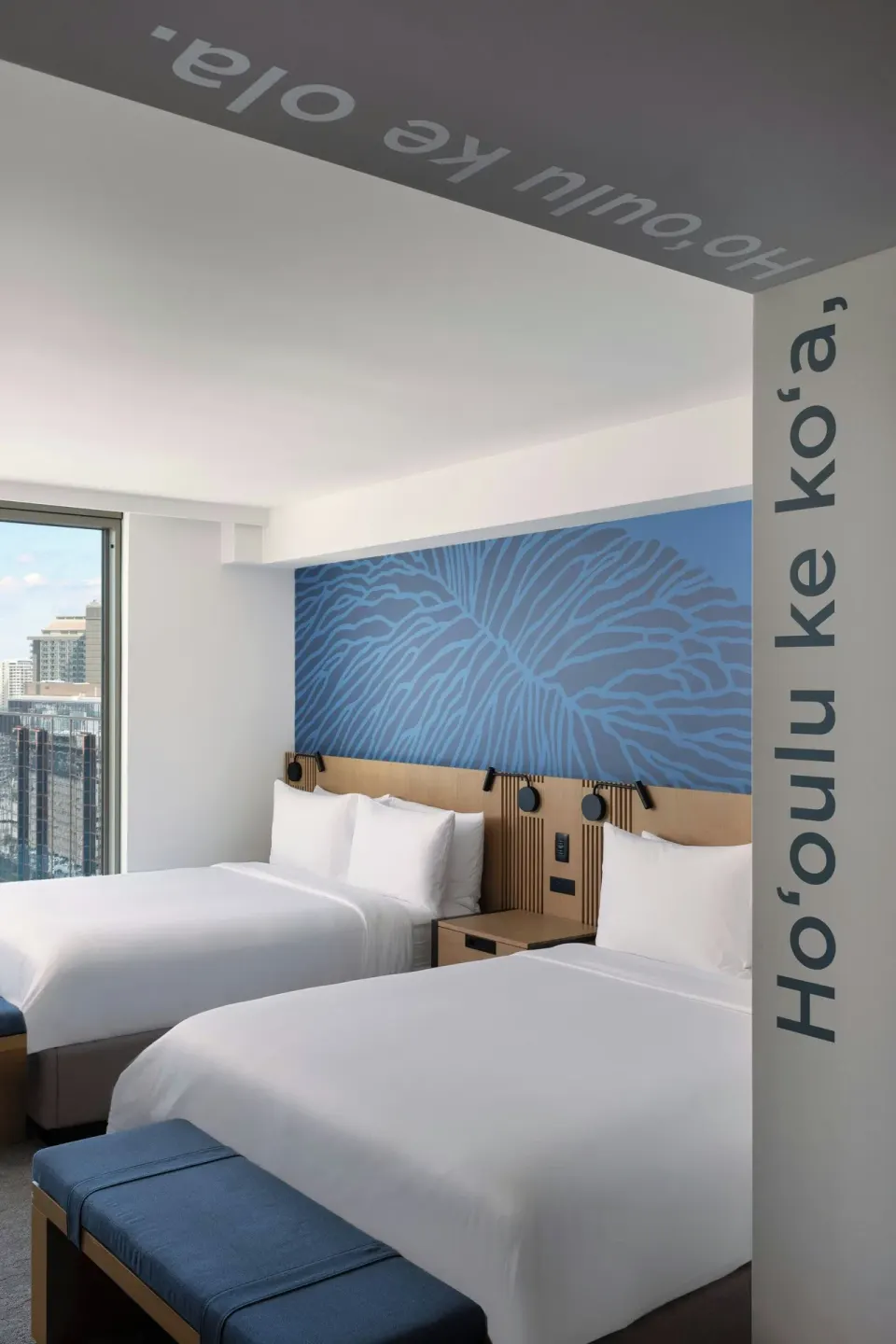 Hearing accessible room with two beds and city window at Renaissance Honolulu Hotel & Spa.