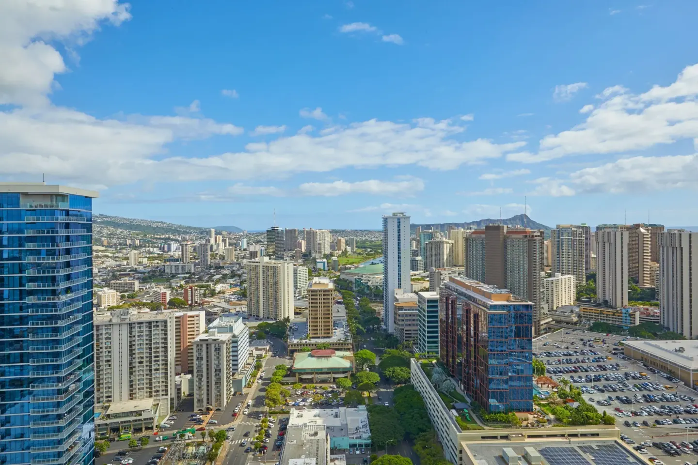 Honolulu skyline city view from Renaissance Honolulu Hotel & Spa with high-rises and Diamond Head in the distance.
