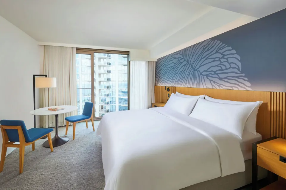 City View Residence king bed and seating area at Renaissance Honolulu Hotel & Spa.
