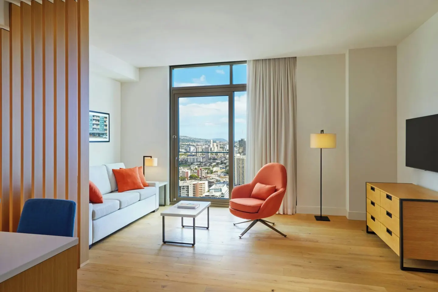 Living area and kitchen edge in the Kaiului Penthouse suite at Renaissance Honolulu Hotel & Spa.