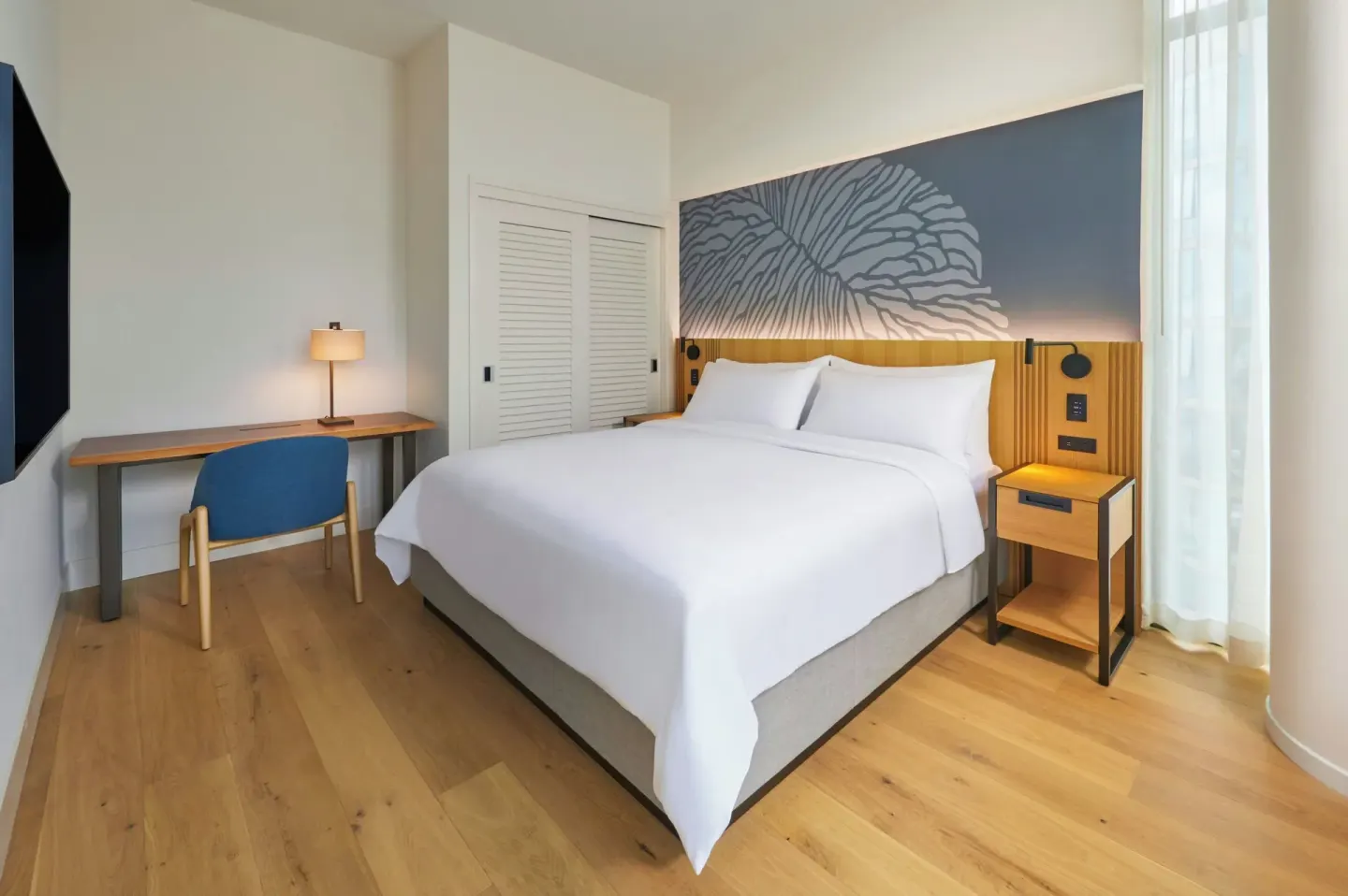 Mountain View one-bedroom suite bedroom with king bed at Renaissance Honolulu Hotel & Spa.