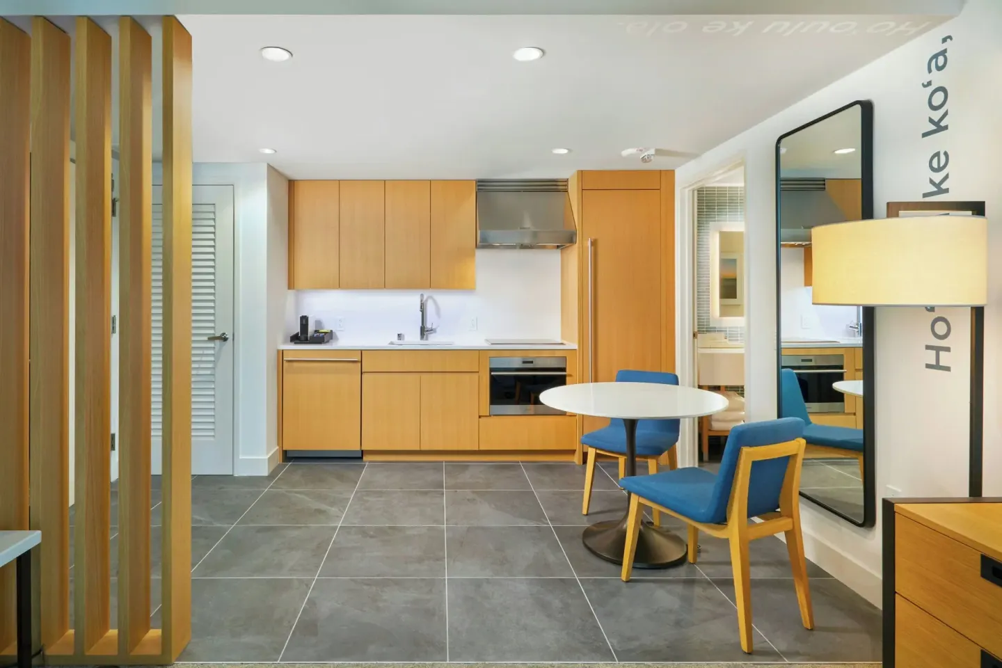 Mountain View one-bedroom suite kitchen and dining area at Renaissance Honolulu Hotel & Spa.