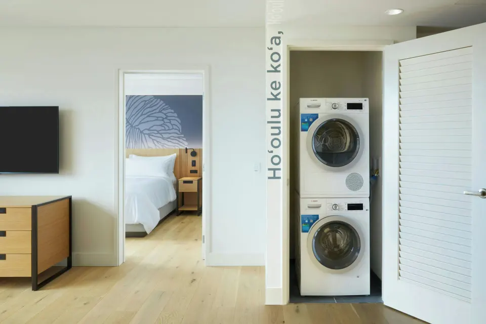 Laundry closet and bedroom doorway in a suite at Renaissance Honolulu Hotel & Spa.