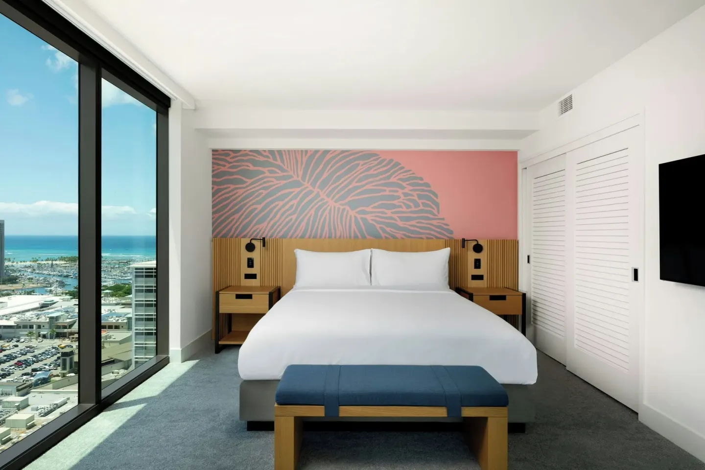 Panoramic View king bedroom at Renaissance Honolulu Hotel & Spa with ocean-facing floor-to-ceiling windows.