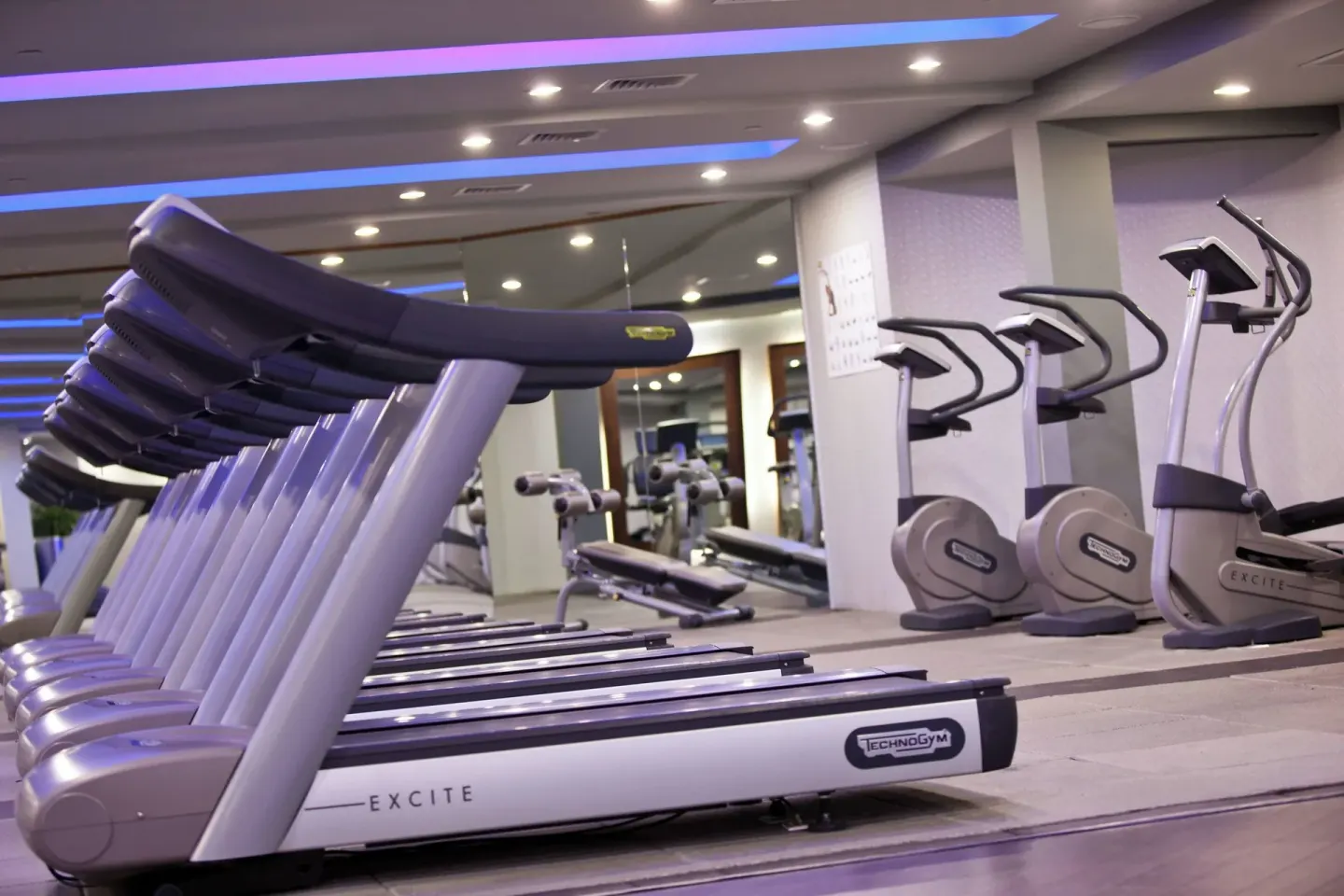 Fitness center with treadmills and cardio machines at Renaissance Wind Creek Aruba Resort.