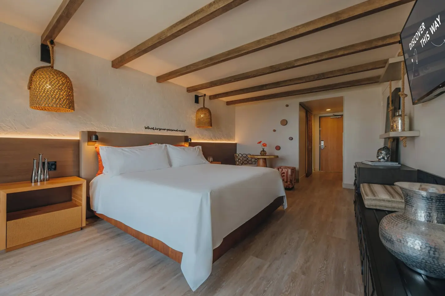 Ocean View room with king bed, dresser, and entry area at Renaissance Wind Creek Aruba Resort.