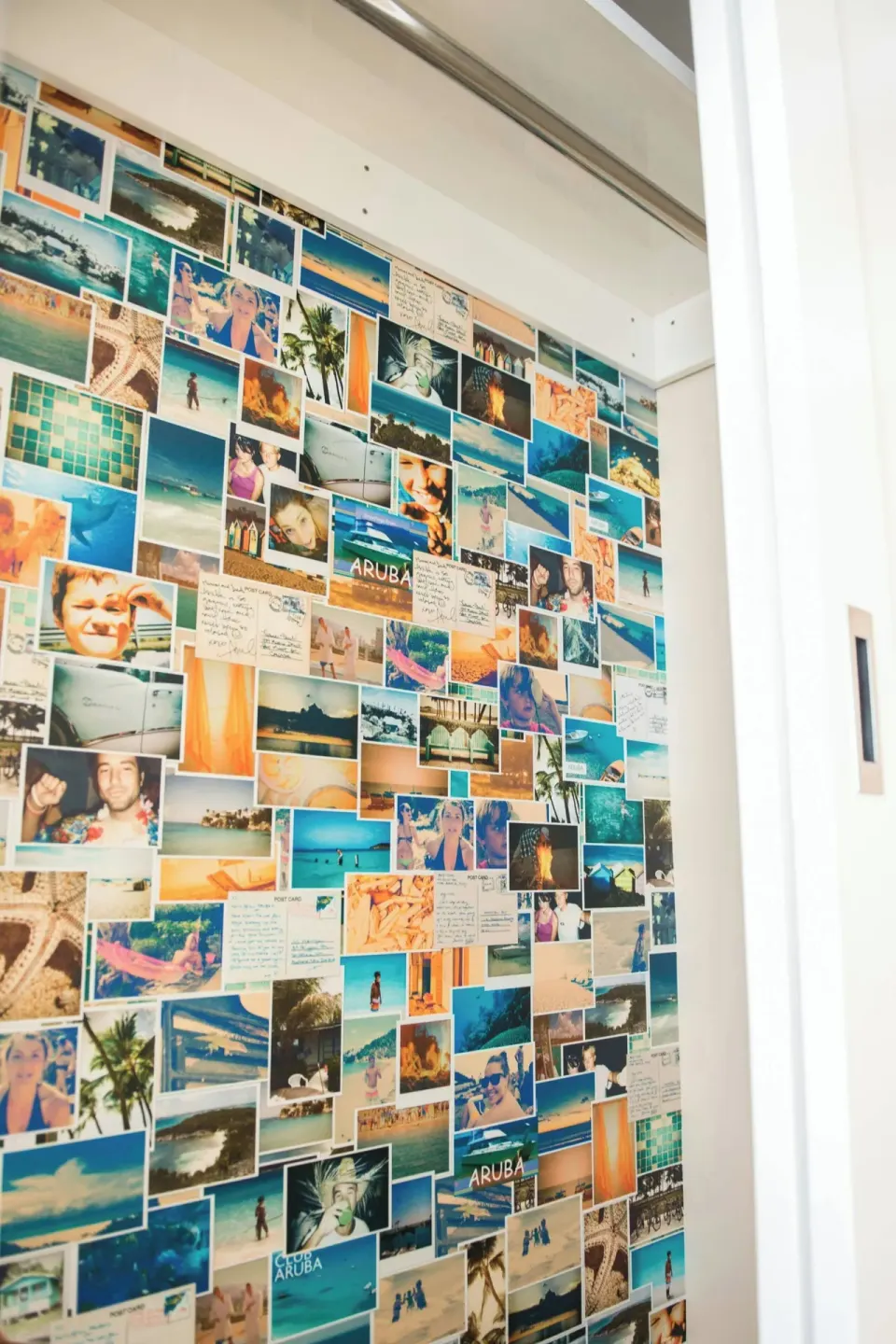 Guest room photo-collage wall with Aruba images at Renaissance Wind Creek Aruba Resort.