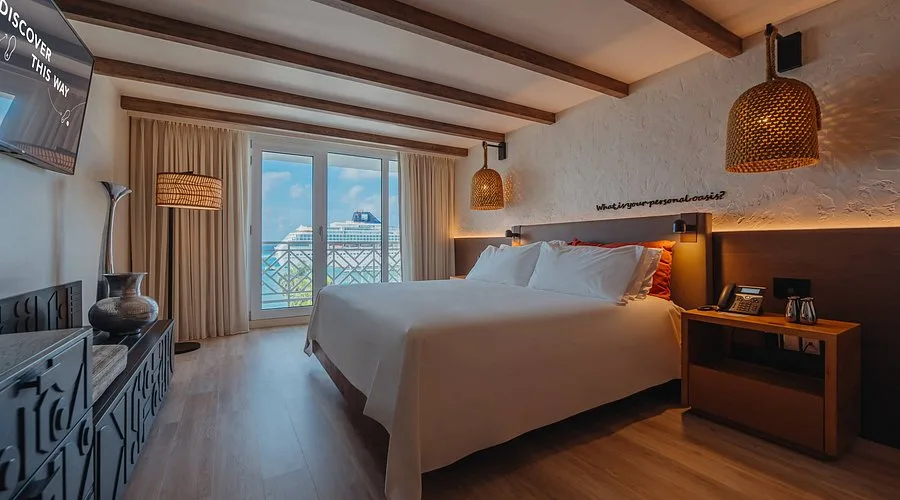 Standard room at Renaissance Wind Creek Aruba Resort with king bed and modern amenities in Oranjestad, Aruba.