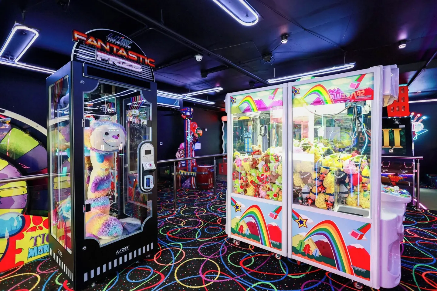 Prize claw machines and colorful arcade games at Renaissance Wind Creek Curacao Resort.