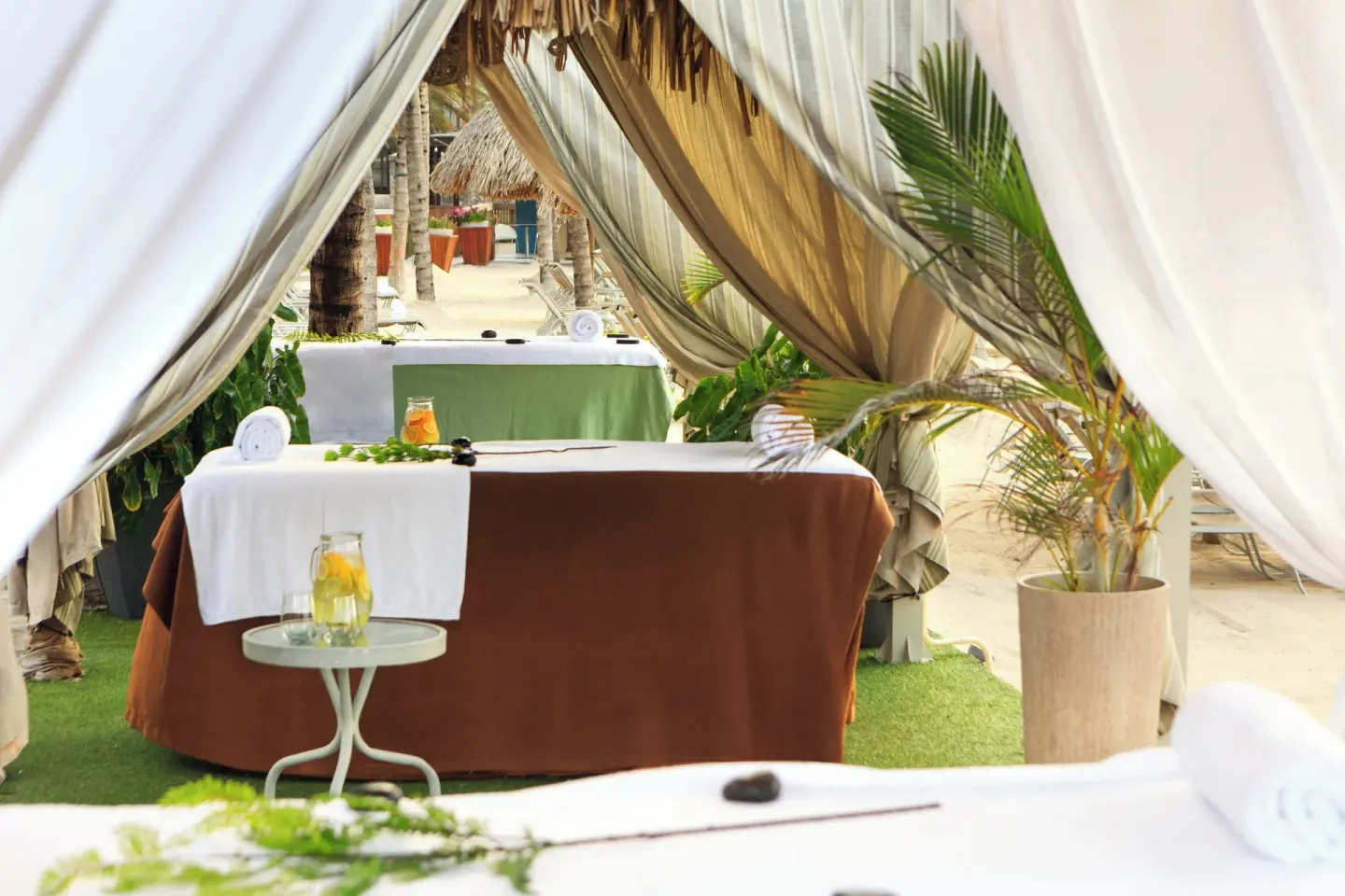 Beach cabana massage tables at Renaissance Wind Creek Curacao Resort.