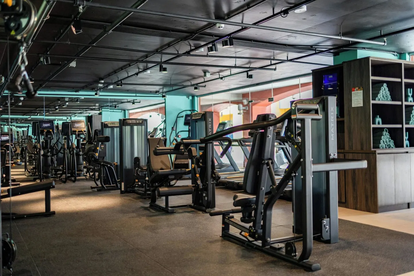 Fitness center weight machines and towel station at Renaissance Wind Creek Curacao Resort.