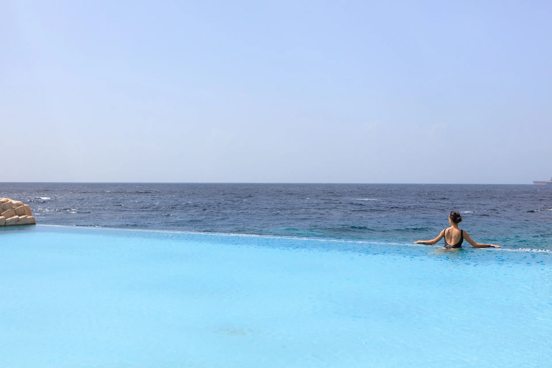 Infinity pool overlooking the ocean at Renaissance Wind Creek Curacao Resort.