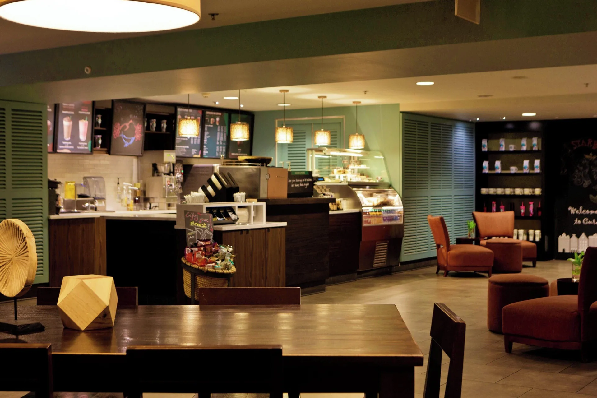 Lobby coffee counter and lounge seating at Renaissance Wind Creek Curacao Resort.