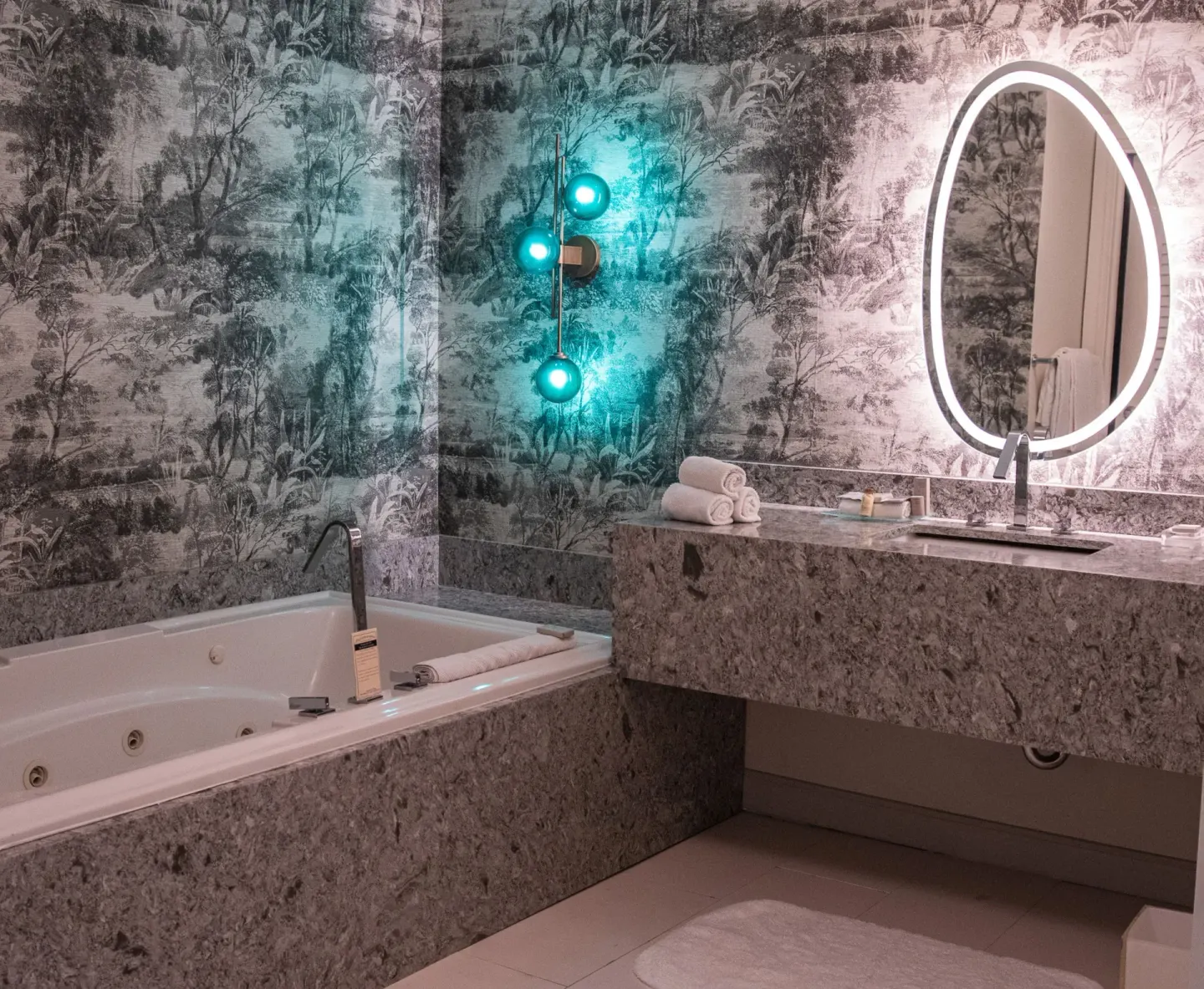 Executive suite bathroom with soaking tub and lit mirror at Renaissance Wind Creek Curacao Resort.