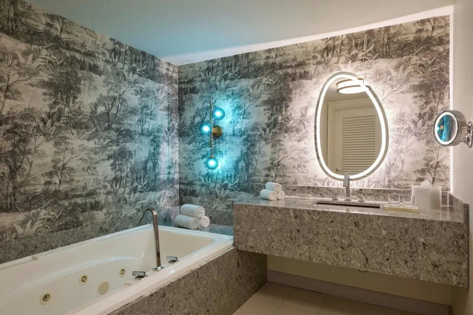 Executive suite bathroom with jetted tub and vanity at Renaissance Wind Creek Curacao Resort.