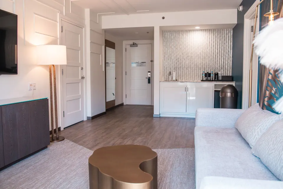 Executive suite living room with wet bar and entry area at Renaissance Wind Creek Curacao Resort.