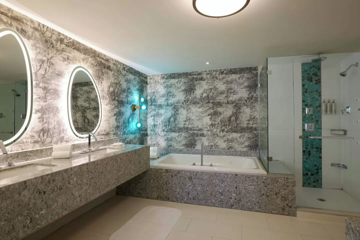 One bedroom suite bathroom with tub, shower and double vanity at Renaissance Wind Creek Curacao Resort.