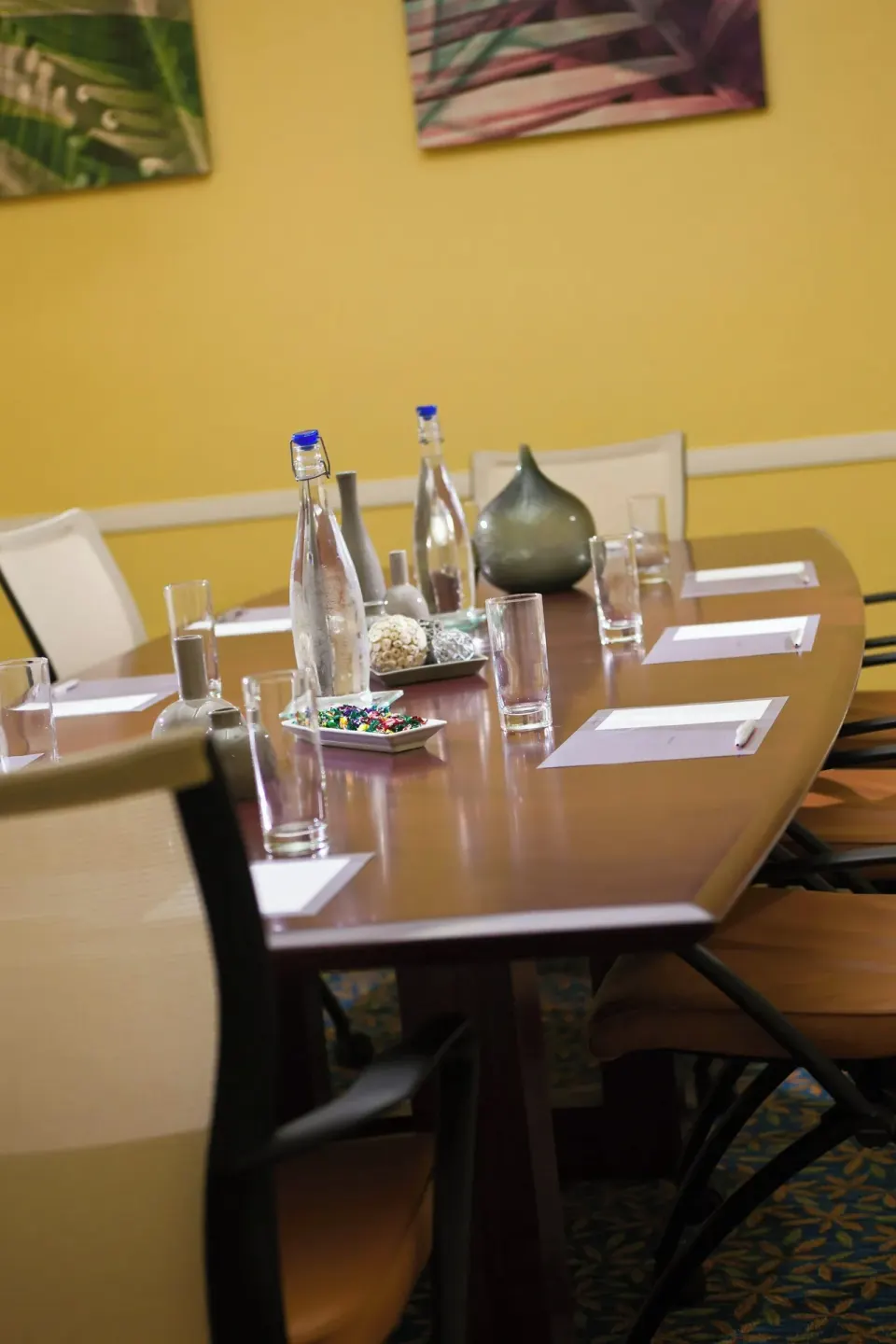 Conference table set with water, glasses and notepads at Renaissance Wind Creek Curacao Resort.