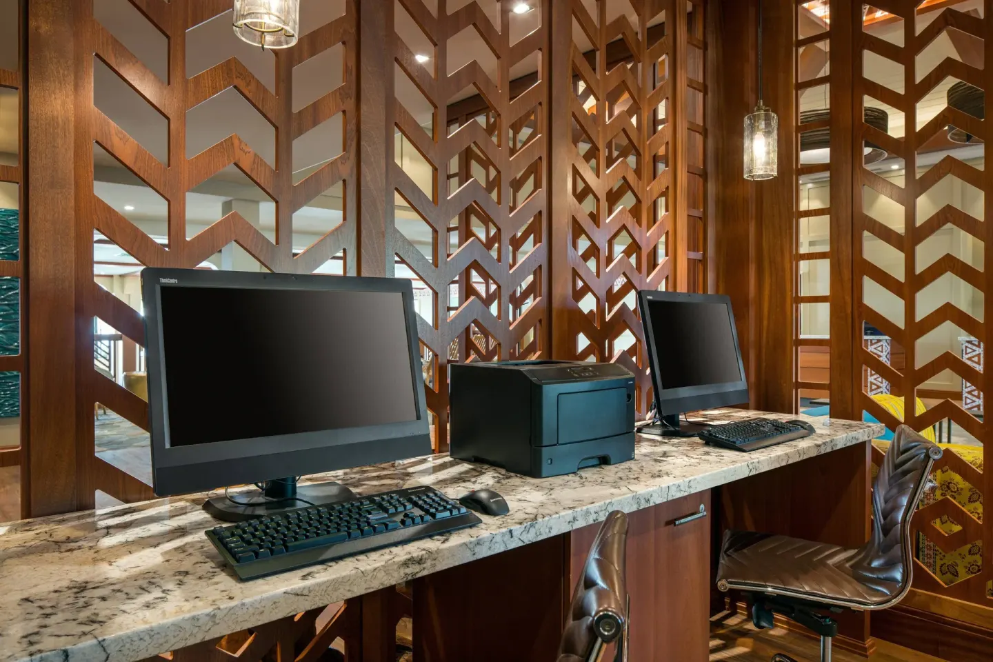 Business center desks with computers and printer at Residence Inn Maui Wailea.