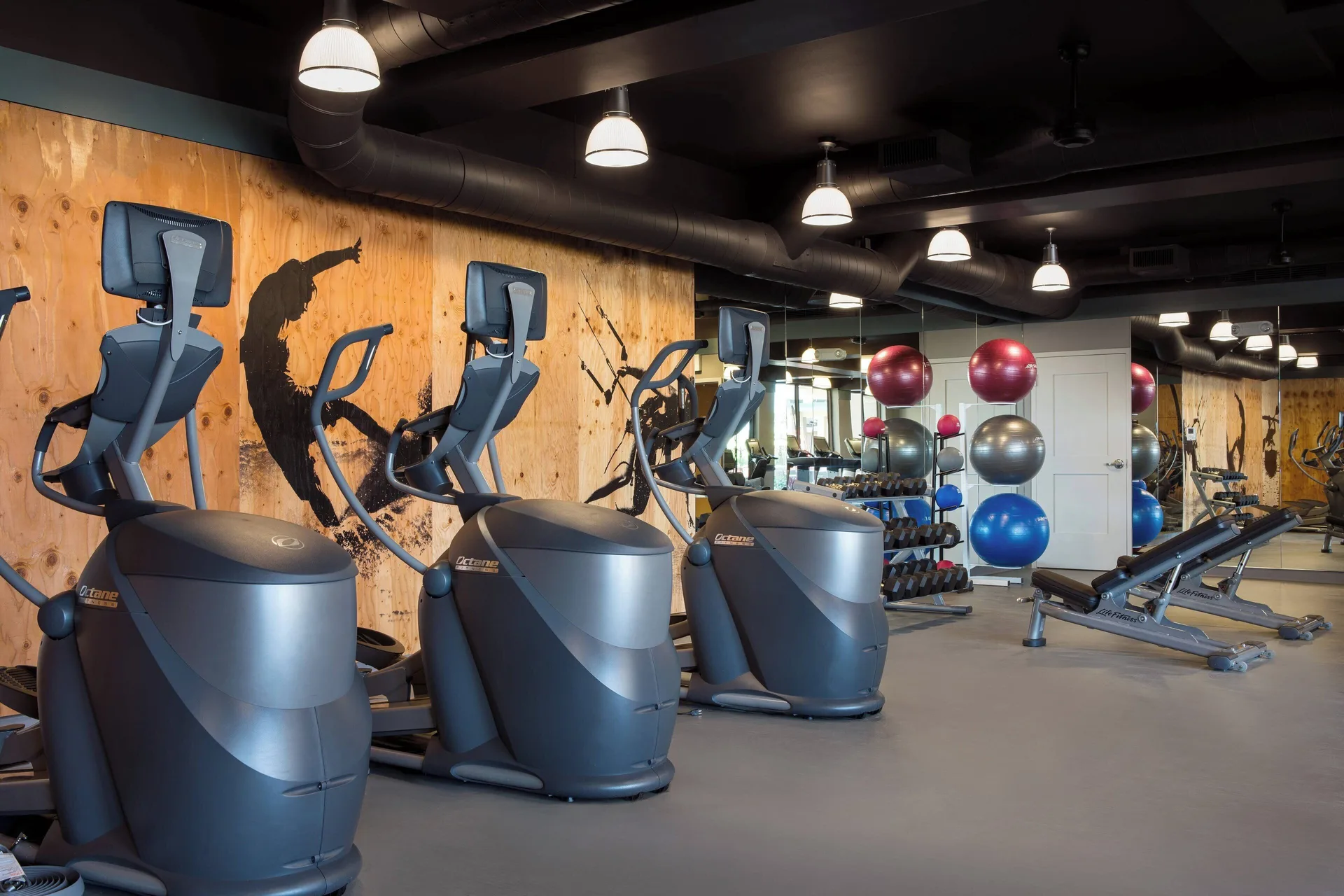 Fitness center with elliptical machines and mirrors at Residence Inn Maui Wailea.