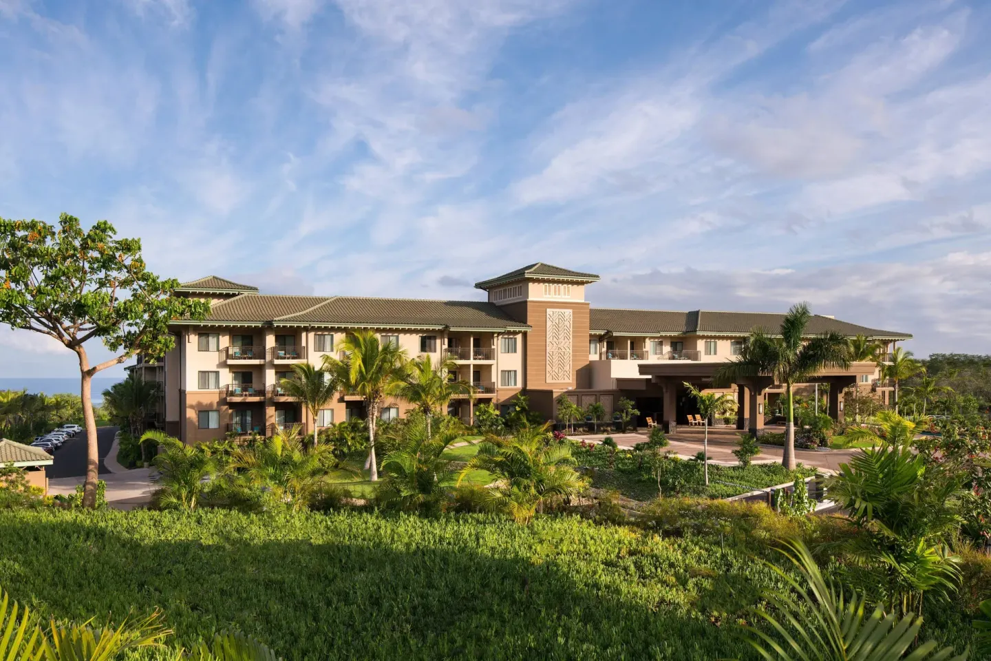 Tropical landscaping and exterior guest building at Residence Inn Maui Wailea.