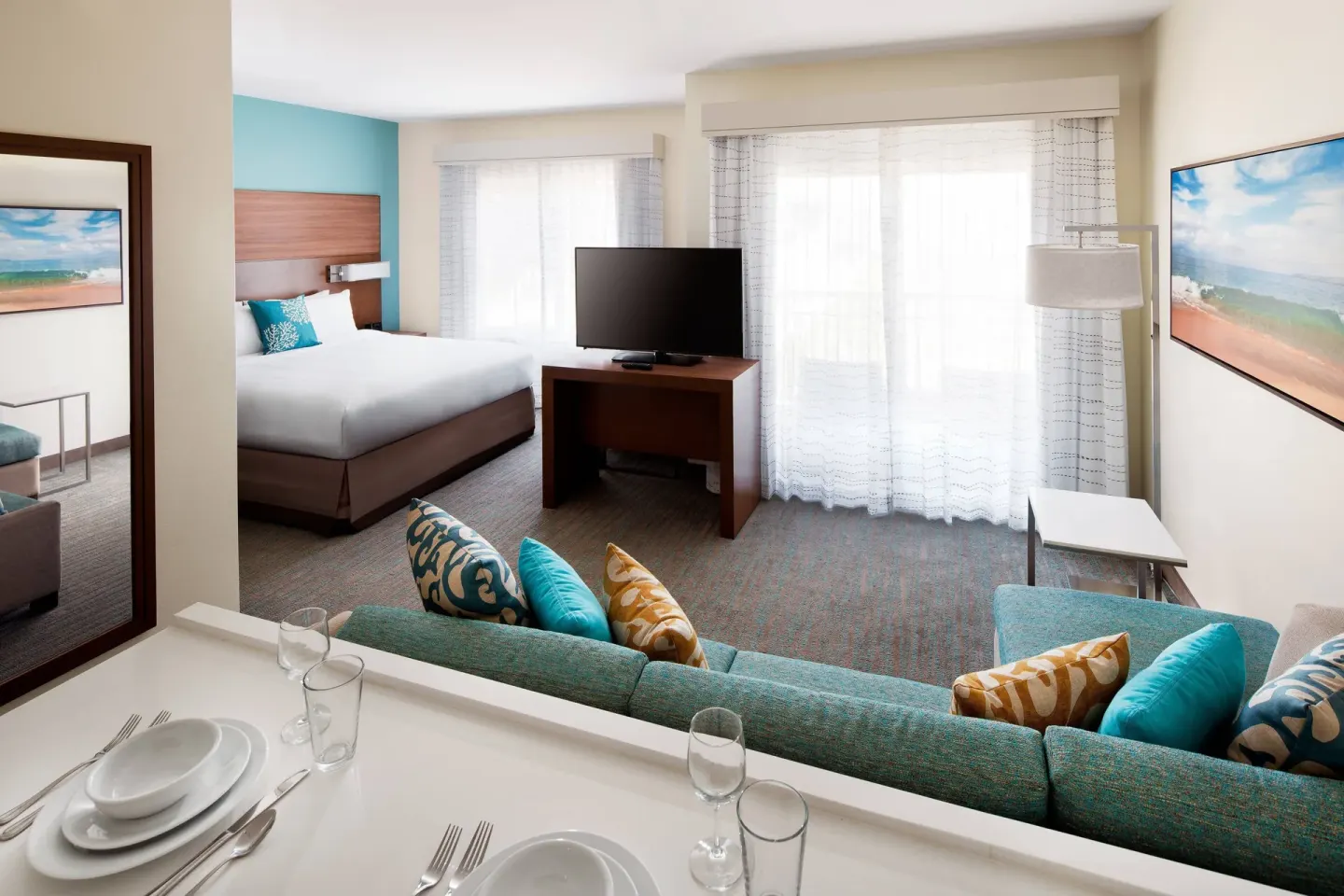 Studio with two beds, sofa, dining counter, and TV at Residence Inn Maui Wailea.