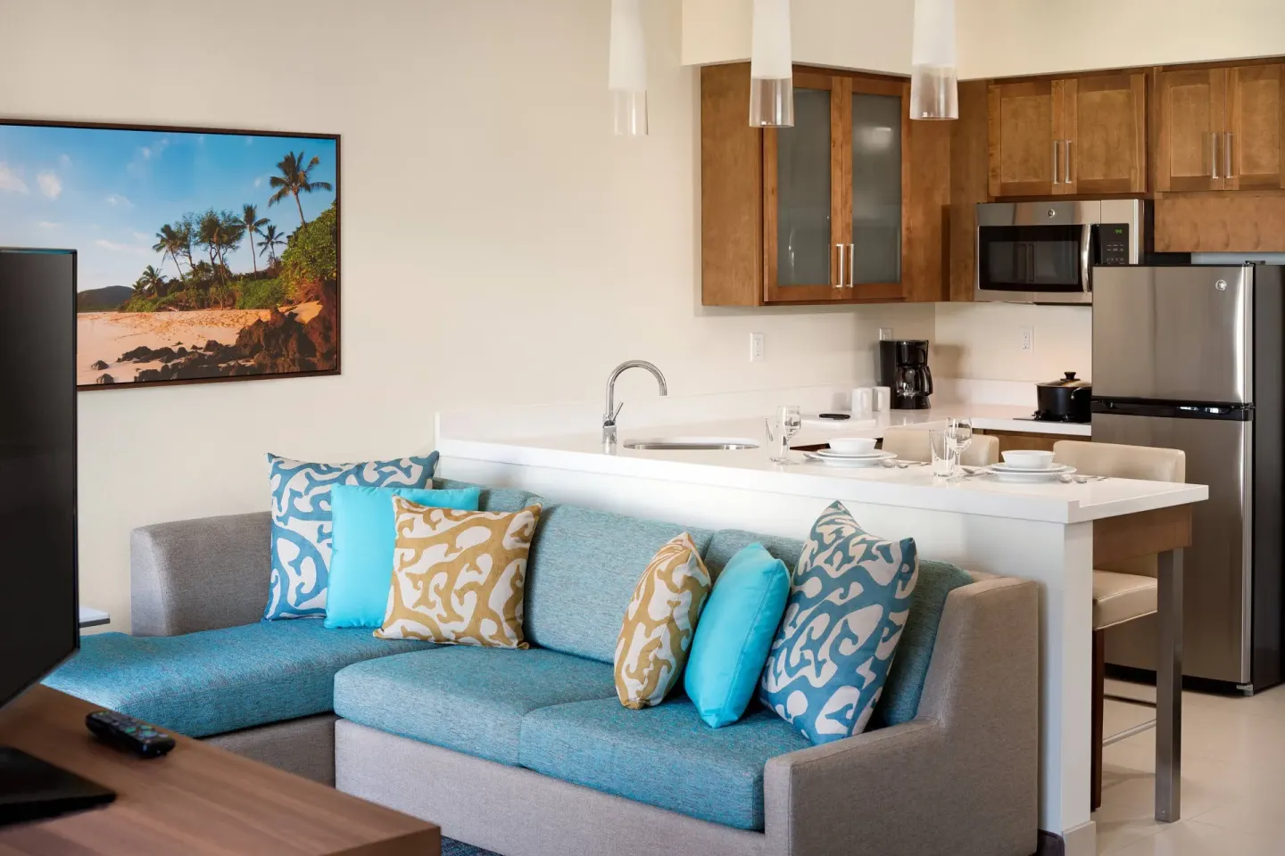 Studio kitchen and sofa seating area at Residence Inn Maui Wailea.