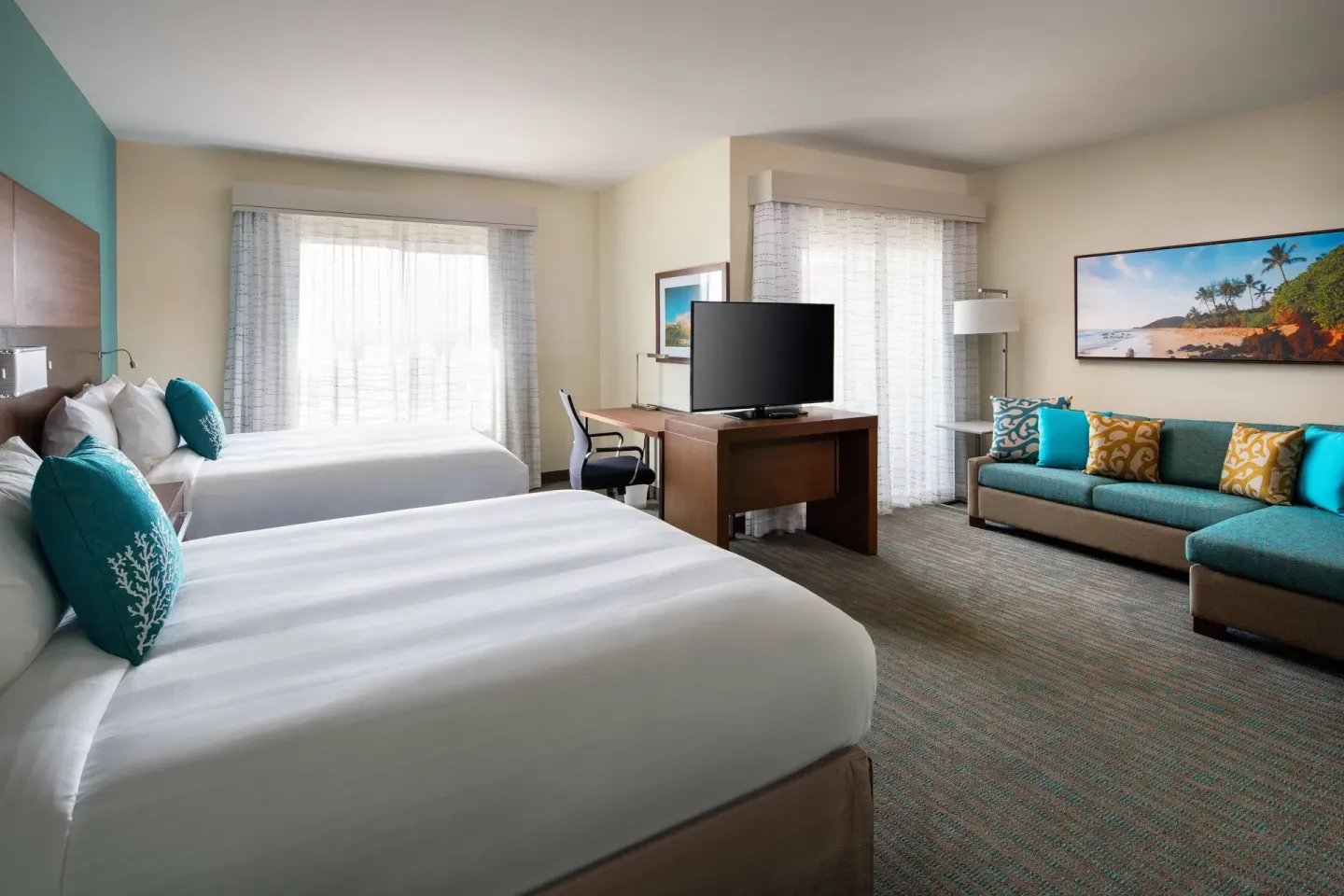 Studio with two beds, sofa, desk, and TV at Residence Inn Maui Wailea.