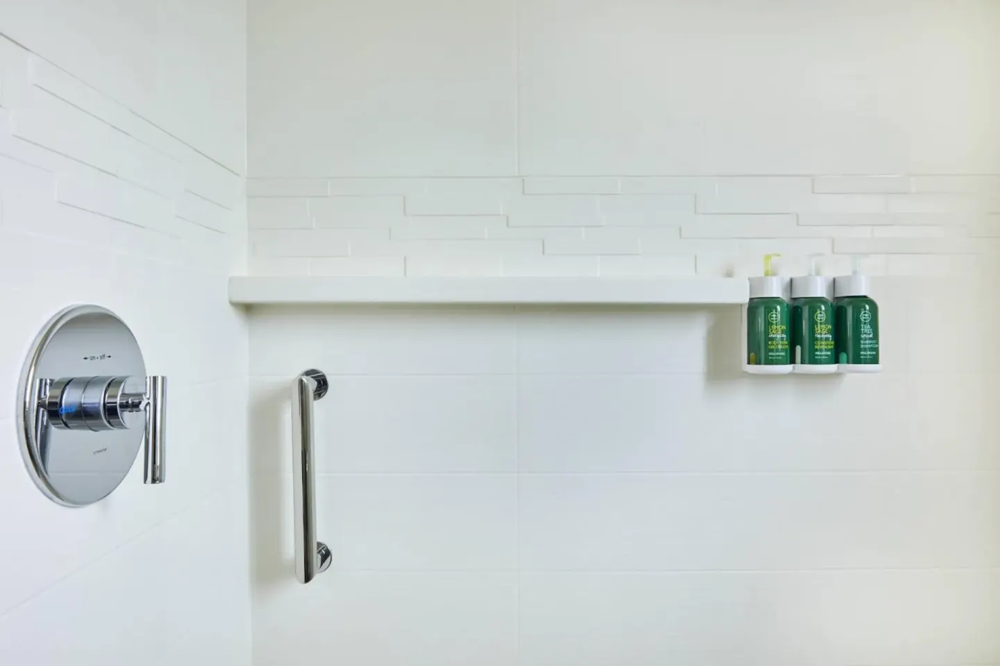 Guest bathroom shower controls and bath amenities at Residence Inn Oahu Kapolei.