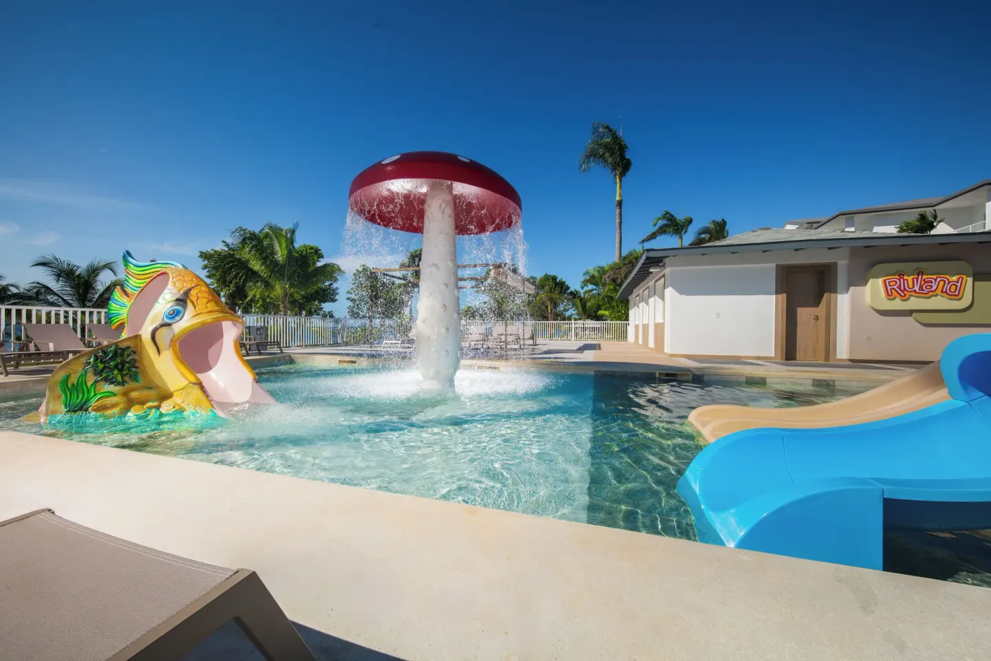 Children's splash pool with slides and water features at Riu Negril.