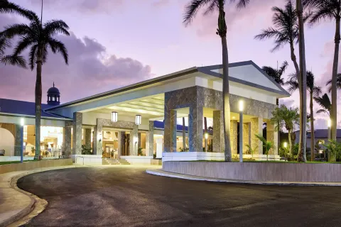 Illuminated entrance canopy and driveway at dusk at Riu Negril.