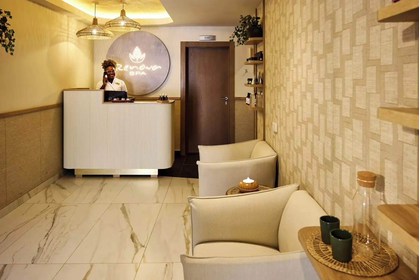 Spa reception with seating, shelves, and warm lighting at Riu Negril.